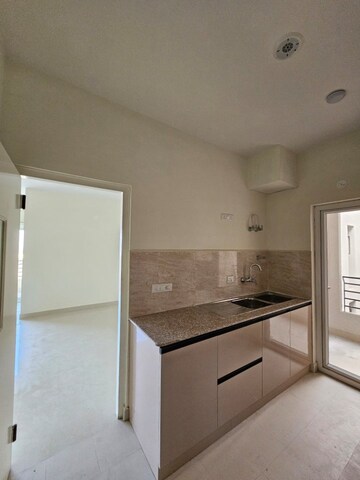 Kitchen in 3 BHK Apartment at Pardos Okas Residency, Sushant Golf City – for Rent