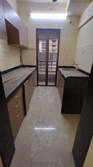 Kitchen in 2 BHK Apartment at Hubtown Greenwoods, Vartak Nagar – for Rent