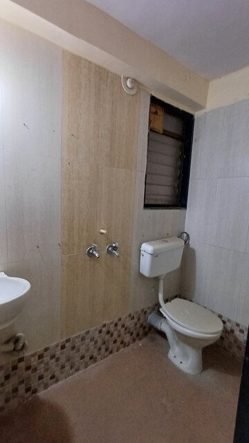 Bathroom in 2 BHK Apartment at Hubtown Greenwoods, Vartak Nagar – for Rent