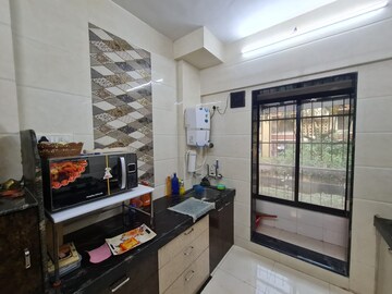 Kitchen in 1 BHK Apartment at Samarpan Anuraj CHS, Borivali East – for Sale