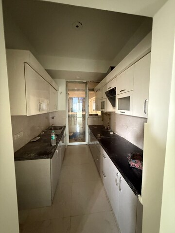 Kitchen in 3 BHK Apartment at Mahagun Mezzaria, Sector 78 – for Rent