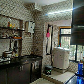 Kitchen in 3 BHK Apartment at AMANN Rashmi Heights, Malad East – for Rent