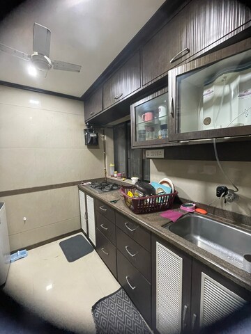Kitchen in 2 BHK Apartment at Runwal Garden City, Balkum Pada – for Rent