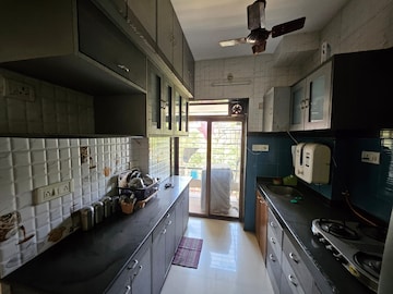 Kitchen in 1.5 BHK Apartment at Living Essence, Kandivali East – for Sale