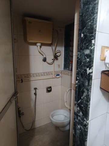 Bathroom in 1 BHK Apartment at Audumber CHS, Goregaon West – for Rent