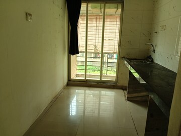 Kitchen in 2 BHK Apartment at Kalp Nisarg Phase II, Shirgaon – for Rent