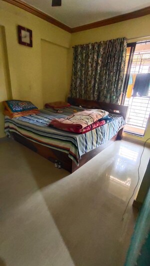 Bedroom in 1 BHK Apartment at Shri New Laxmi Villa CHS, Dombivli West – for Sale