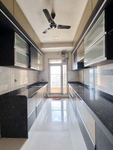Kitchen in 3 BHK Apartment at Rustomjee Azziano Wing I, Thane West – for Rent