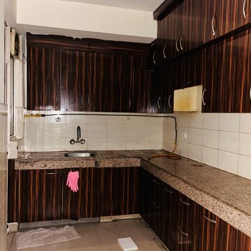 Kitchen in 2 BHK Apartment at Logix Blossom Greens, Sector 143 – for Sale