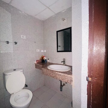 Bathroom in 2 BHK Apartment at Logix Blossom Greens, Sector 143 – for Sale