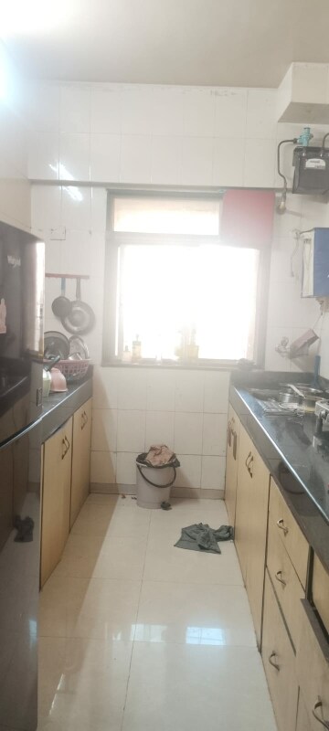 Kitchen in 2 BHK Apartment at Nirmal Lifestyle Residency CHS Ltd, Mulund West – for Rent