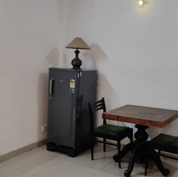 Living Room in Studio Apartment at Supertech Czar Suites, Omicron I Greater Noida – for Rent