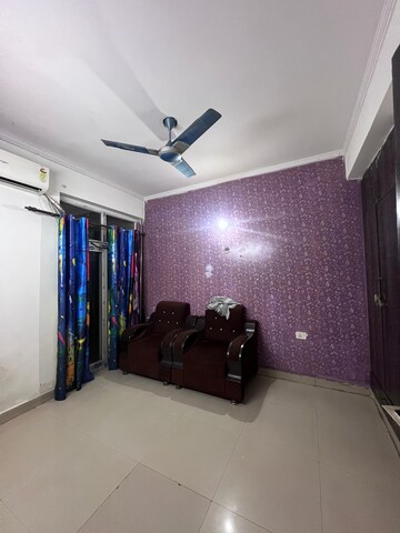 Living Room in 2.5 BHK Apartment at Aims Golf City, Sector 75 – for Rent
