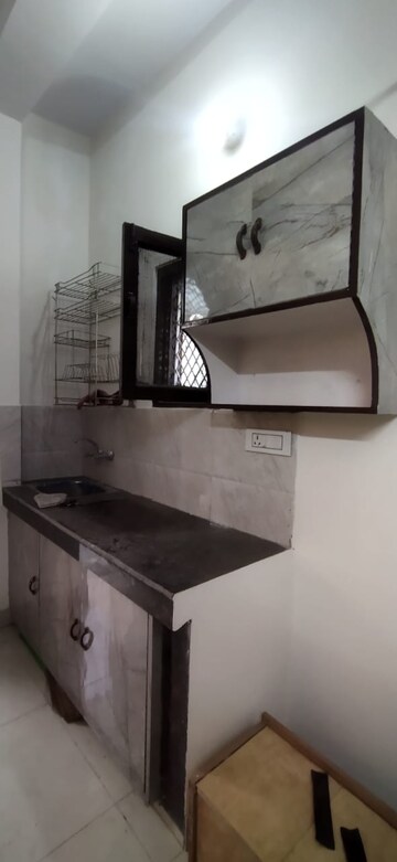 Kitchen in 1 RK Apartment at RWA Jasola Sector 8 SFS Flat, Jasola – for Rent