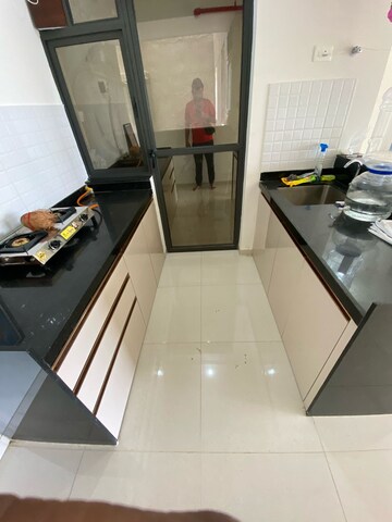 Kitchen in 2 BHK Apartment at Shapoorji Pallonji Vanaha Golfland, Bavdhan – for Rent
