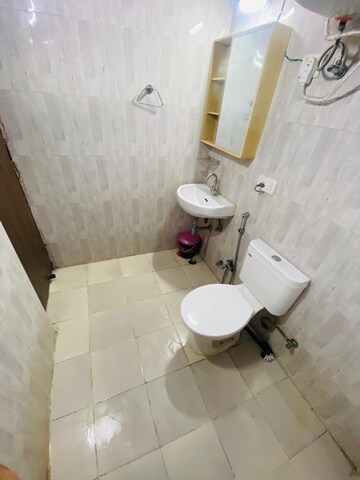 Bathroom in 3 BHK Apartment at Devika Skypers, Raj Nagar Extension – for Rent