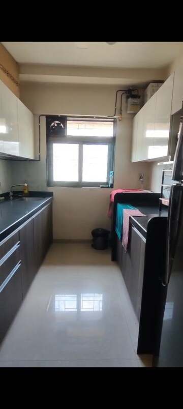 Kitchen in 2 BHK Apartment at Lashkaria Anurag CHS, Andheri West – for Rent