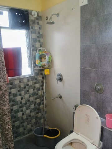 Bathroom in 2 BHK Apartment at Axis Paradigm Whistling Meadows, Paud Road – for Sale