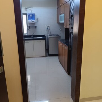Kitchen in 3 BHK Apartment at Romell Umiya Grandeur, Churi Wadi – for Rent