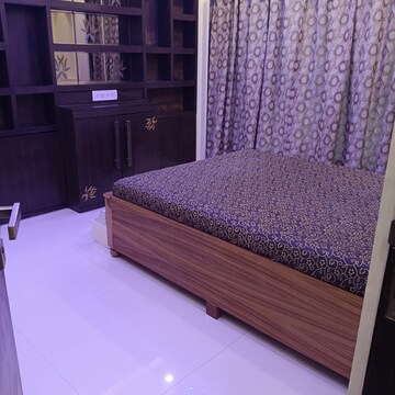 Bedroom in 3 BHK Apartment at Romell Umiya Grandeur, Churi Wadi – for Rent