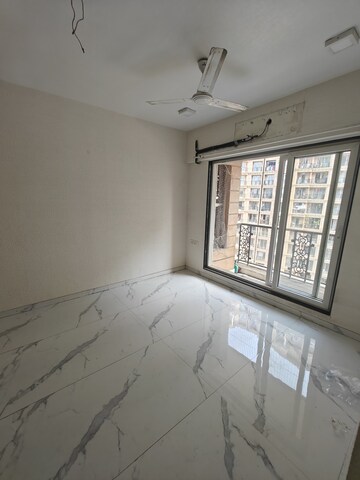 Living Room in 1 BHK Apartment at JK Iris, Mira Road – for Sale
