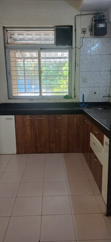 Kitchen in 2 BHK Apartment at Vasant Sagar, Kandivali East – for Rent