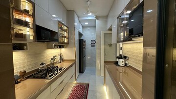 Kitchen in 1 BHK Apartment at Raunak Unnathi Woods Phase 7 A And B, Ghodbunder Road – for Rent