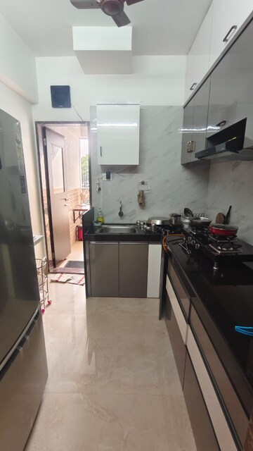 Kitchen in 2 BHK Apartment at Surya Sadan Naupada, Naupada – for Rent