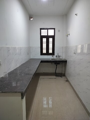 Kitchen in 2 BHK Apartment at Ganga Apartments Burari, Burari – for Rent