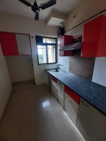 Kitchen in 1 BHK Apartment at Puranik Hometown, Ghodbunder Road – for Rent