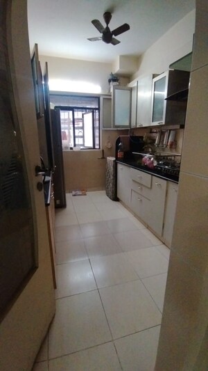 Kitchen in 2 BHK Apartment at Ani Anu Sri Balaji Enclave, Malad West – for Sale