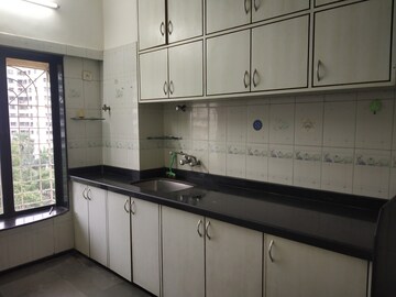 Kitchen in 2 BHK Apartment at Planet Powai CHS, Powai – for Rent