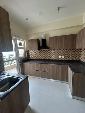 Kitchen in 4 BHK Apartment at Adani Oyster Platinum Tower, Sector 102 – for Rent