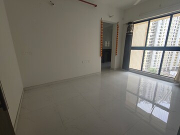 Living Room in 1 BHK Apartment at Runwal Gardens, Dombivli East – for Rent