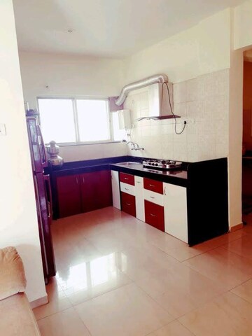 Kitchen in 3 BHK Apartment at Daffodils Housing Society Row House, Pimple Saudagar – for Rent