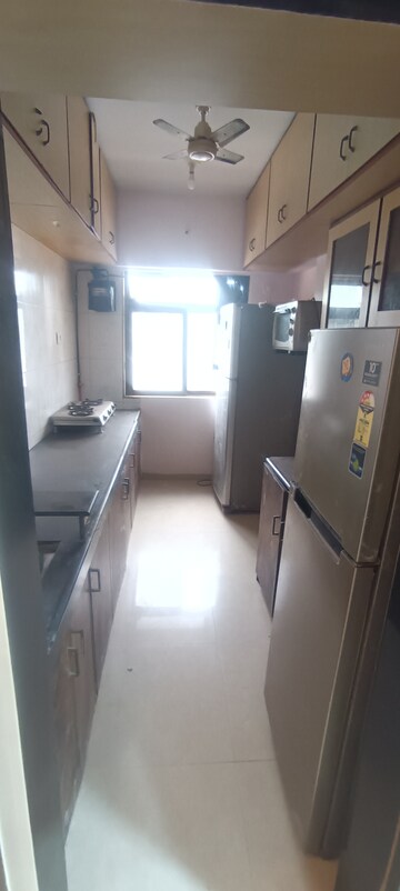Kitchen in 2.5 BHK Apartment at Dheeraj Heritage Residency, Santacruz West – for Rent