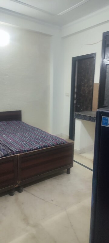 Bedroom in 1.5 BHK Builder Floor at RWA Qutab Enclave, Katwaria Sarai – for Rent