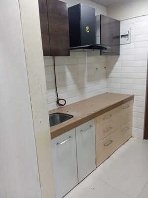 Kitchen in 1.5 BHK Apartment at Flower Valley Complex, Khopat – for Sale