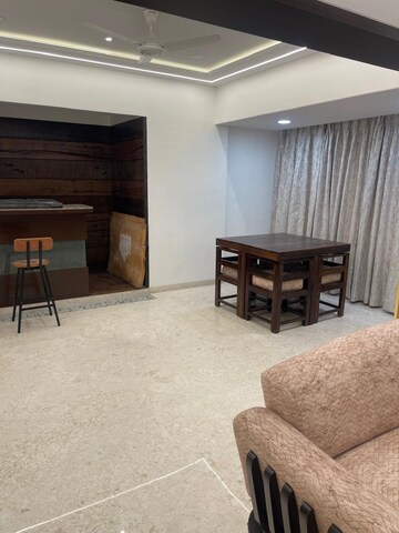 Living Room in 4 BHK Apartment at Orchid Towers, Andheri West – for Rent