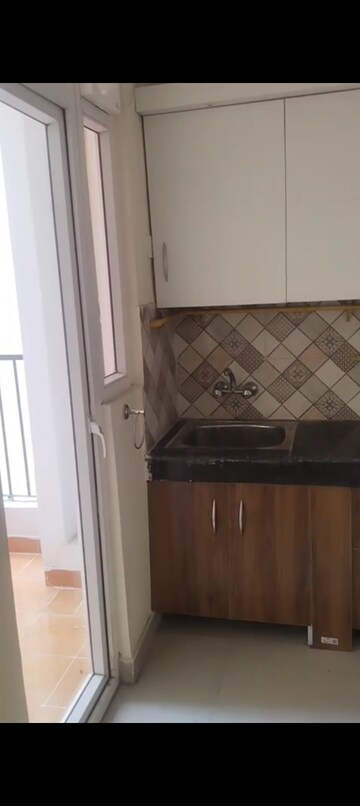 Kitchen in 2 BHK Apartment at Nilaya Greens, Raj Nagar Extension – for Rent