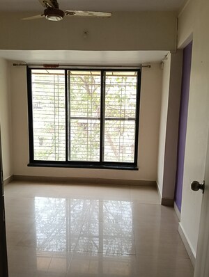 Bedroom in 2 BHK Apartment at Tulsi Vihar CHS, Dombivli West – for Sale