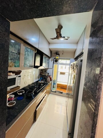 Kitchen in 2 BHK Apartment at Rustomjee Urbania Azziano, Thane West – for Sale