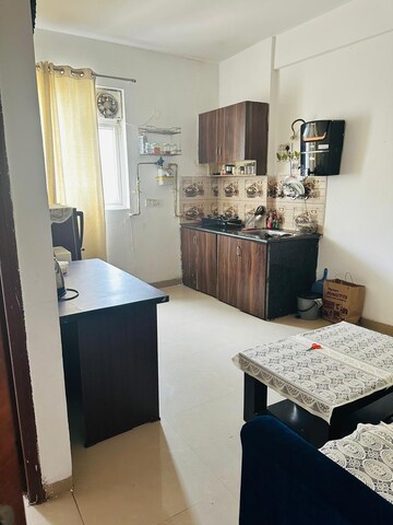 Living Room in 1 BHK Apartment at Urbtech Xaviers, Sector 168 – for Rent