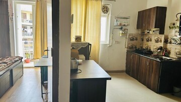 Living Room in 1 BHK Apartment at Urbtech Xaviers, Sector 168 – for Rent