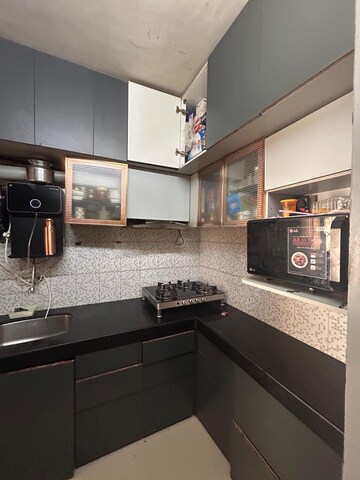 Kitchen in 2 BHK Apartment at Zaveri Ashtavinayak CHS, Andheri West – for Rent