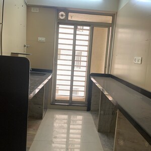 Kitchen in 1 BHK Apartment at The Wadhwa Parwana Tower, Saibaba Nagar – for Sale