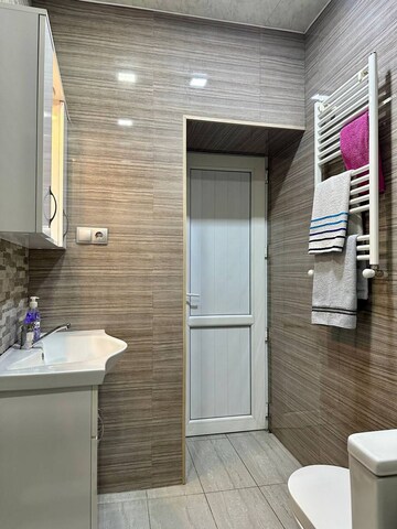 Bathroom in 3 BHK Apartment at Aims Golf City, Sector 75 – for Sale