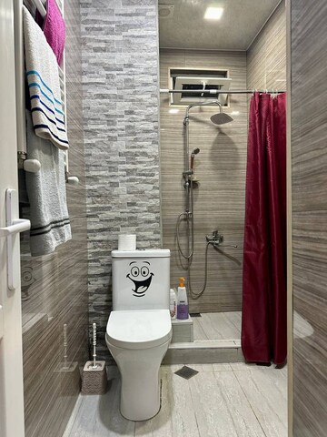 Bathroom in 3 BHK Apartment at Aims Golf City, Sector 75 – for Sale