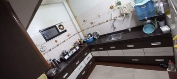 Kitchen in 2 BHK Apartment at Ajmera Casa Vyoma, Vastrapur – for Rent