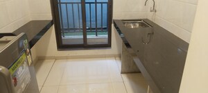 Kitchen in 1 BHK Apartment at Pushpanjali Heights, Owale – for Sale